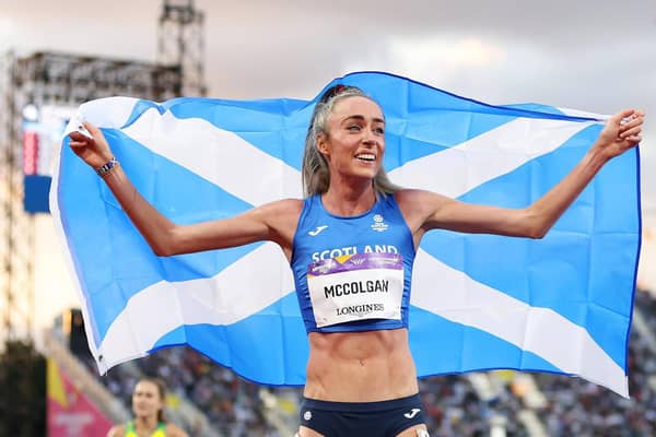 Eilish McColgan of Team Scotland celebrates with their teams flag after winning the gold medal in the Women's 10,000m Final on day six of the Birmingham 2022