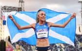 Eilish McColgan of Team Scotland celebrates with their teams flag after winning the gold medal in the Women's 10,000m Final on day six of the Birmingham 2022
