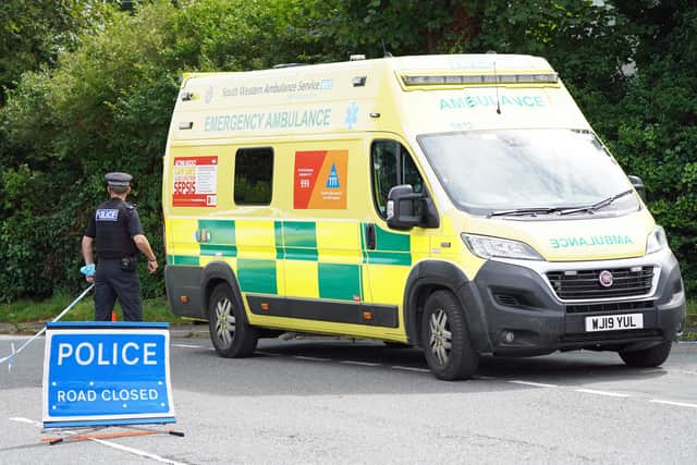 A coroners ambulance leaves Royal Navy Avenue in the Keyham area of Plymouth where six people, including the offender, died of gunshot wounds in a firearms incident Thursday evening.