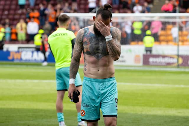 Dundee Utd's Steven Fletcher is dejected after relegation was confirmed with defeat at Motherwell. (Photo by Alan Harvey / SNS Group)