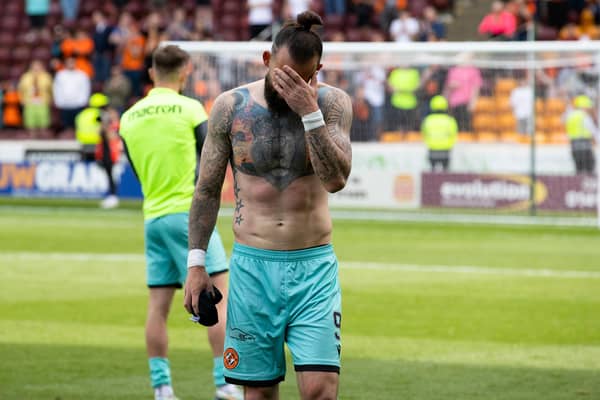 Dundee Utd's Steven Fletcher is dejected after relegation was confirmed with defeat at Motherwell.  (Photo by Alan Harvey / SNS Group)