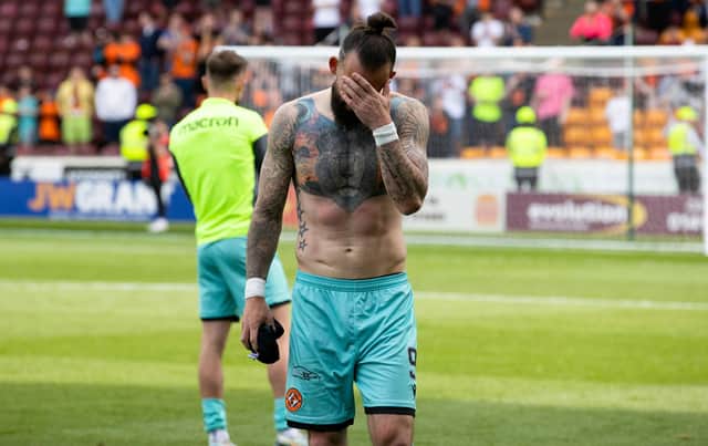 Dundee Utd's Steven Fletcher is dejected after relegation was confirmed with defeat at Motherwell.  (Photo by Alan Harvey / SNS Group)