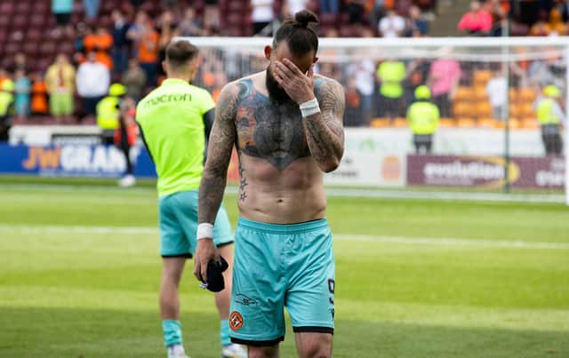 Dundee Utd's Steven Fletcher is dejected after relegation was confirmed with defeat at Motherwell. (Photo by Alan Harvey / SNS Group)