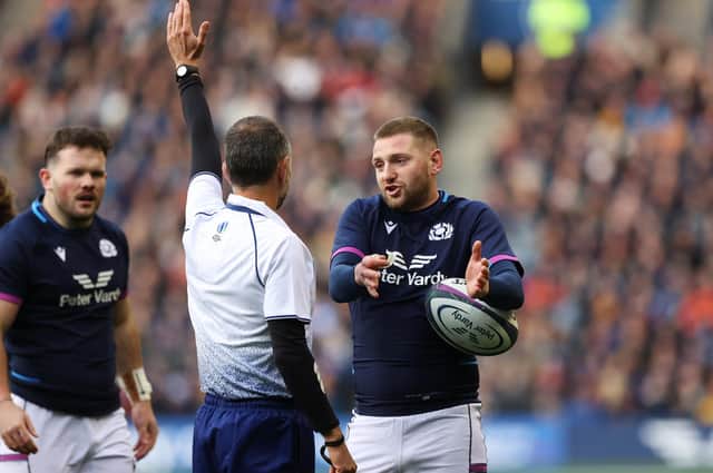 Finn Russell chats to referee Roman Poite during a Scotland-Australia match at Murrayfield. (Photo by Craig Williamson / SNS Group)
