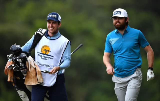 Liam Johnston walks with his caddie on the 15th hole during the opening round of the Kenya Savannah Classic at Karen Country Club in Nairobi. Picture: Stuart Franklin/Getty Images.
