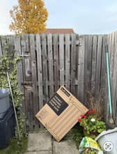 If you haven't designated a 'safe space' the delivery person may decide 'over the fence' is fine