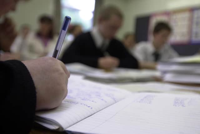 The OECD report has said Scottish teachers are spending too much time in classrooms