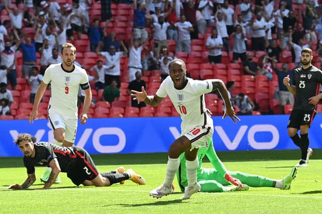 England forward Raheem Sterling celebrates scoring against Croatia in the Group D opener at Wembley. (Photo by GLYN KIRK/POOL/AFP via Getty Images)