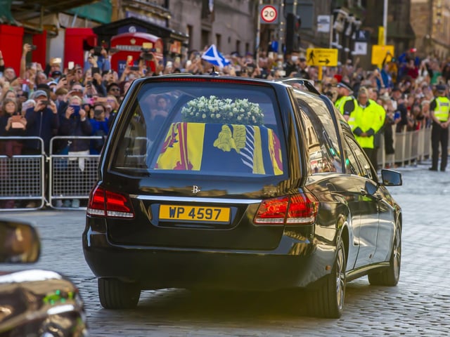 The hearse carrying the coffin of Queen Elizabeth II departs St Giles' Cathedral, for Edinburgh Airport, where it was flown by the Royal Air Force to RAF Northolt. Photo: Lisa Ferguson/The Scotsman