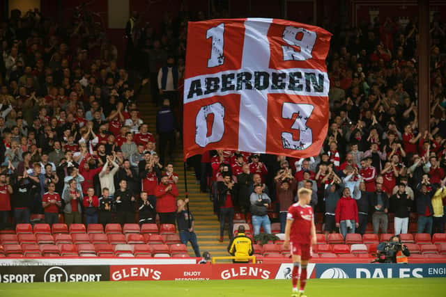 Dons fans in the Red Shed. (Photo by Ross Parker / SNS Group)