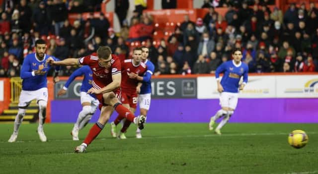 ABERDEEN, SCOTLAND - JANAURY 18: Aberdeen's Lewis Ferguson makes it 1-1 from the penalty spot during a Cinch Premiership match between Aberdeen and Rangers at Pittodrie, on January 18, 2022, in Aberdeen, Scotland. (Photo by Craig Williamson / SNS Group)