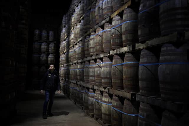 Iain McAlister, master distiller and distillery manager, tours the bonded warehouse checking on the maturing casks, at Glen Scotia single malt whisky distillery, in Campbeltown. PIC: Jeremy Sutton-Hibbert.
