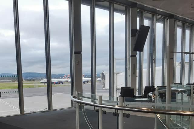 A deserted departure area at Glasgow Airport looking onto a collection of parked British Airways aircraft. Picture: The Scotsman