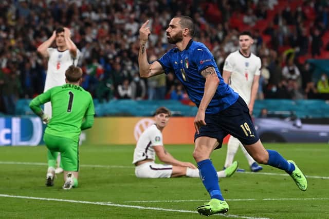 Leonardo Bonucci celebrates after scoring Italy's second half equaliser in the Euro 2020 final against England at Wembley. (Photo by PAUL ELLIS/POOL/AFP via Getty Images)