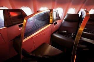 Seats in Virgin Atlantic's Upper Class cabins convert into lie-flat beds. (Photo by Virgin Atlantic)