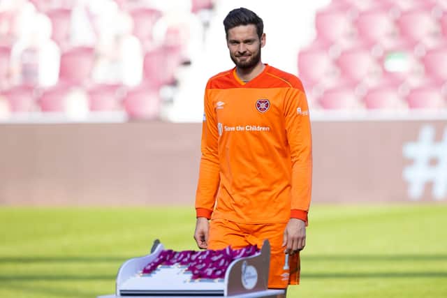 Hearts goalkeeper Craig Gordon collects his medal at Tynecastle on Saturday.