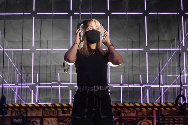 Visitor assistant Lucy Hendry in Night Fever's 'socially distanced silent disco.' Picture: Michael McGurk