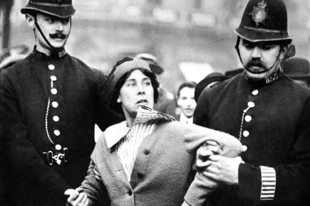 A suffragette is arrested by police officers in 1914. The Representation of the People Act, passed in 1918, gave certain women over the age of 30 a vote and the right to stand for Parliament. (Picture: PA)