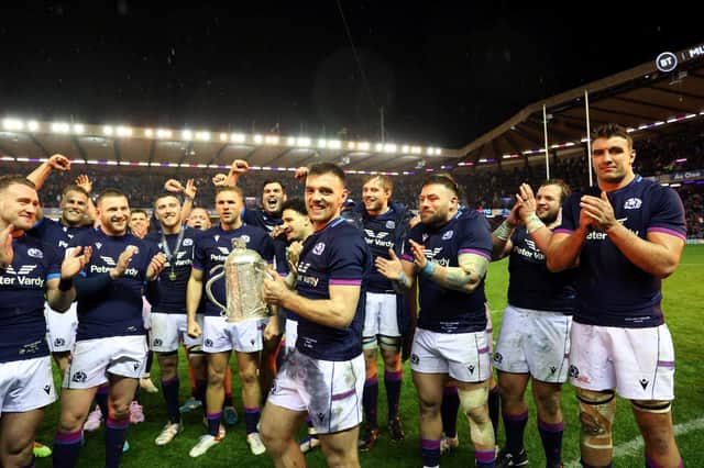 Scotland celebrate last season's win over England, with try-scoring debutant Ben White holding the Calcutta Cup.  (Photo by Craig Williamson / SNS Group)