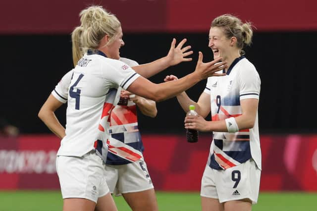 Ellen White is congratulated by her Team GB team-mates after scoring the winner against Japan