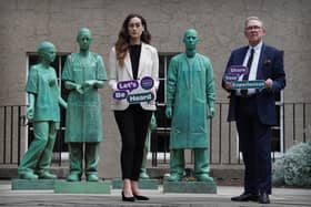 Dr Alexandra Anderson and Lord Brailsford of the inquiry team at the NHS memorial statue within the grounds of The Royal College of Surgeons, Edinburgh. (Pic:  Stewart Attwood)