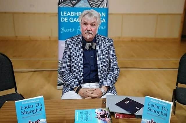 Donald Ian MacLeod at a signing session for his award-winning book Eadar Da Shaoghal
