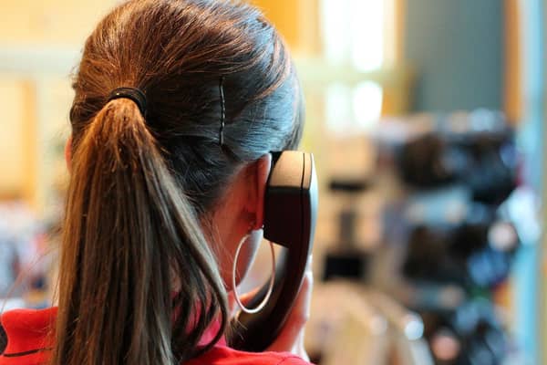 Almost 150,000 NHS 24 calls were abandoned before the caller spoke to an operator in the first half of this year, according to new figures.