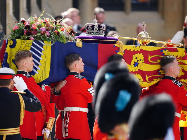 The coffin of Queen Elizabeth II being carried by pallbearers leaving the State Funeral held at Westminster Abbey, London. Picture date: Monday September 19, 2022.