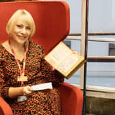 Cultural services assistant Donna Dewar with the library book that has been returned more than 73 years late.