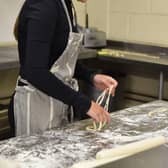 A participant making hand-pulled noodles.
