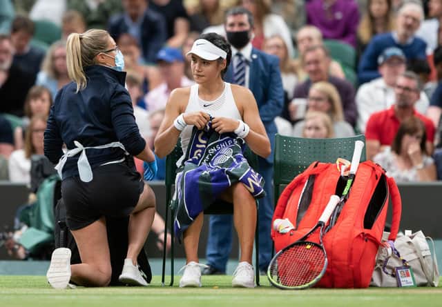 Emma Raducanu receives treatment during a medical time out in the match against Ajla Tomljanovic.