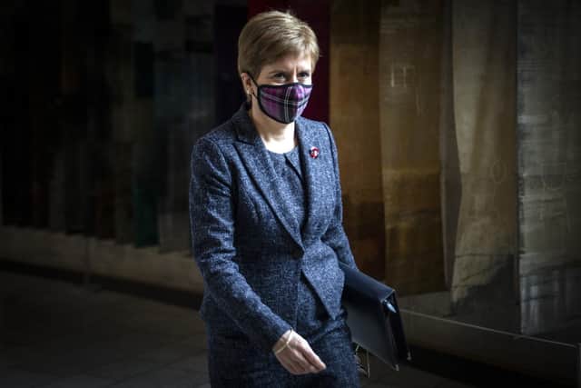 Scotland's First Minister Nicola Sturgeon arrives at the Scottish Parliament wearing a mask because of the coronavirus pandemic. Picture: Andy Buchanan-WPA Pool/Getty Images