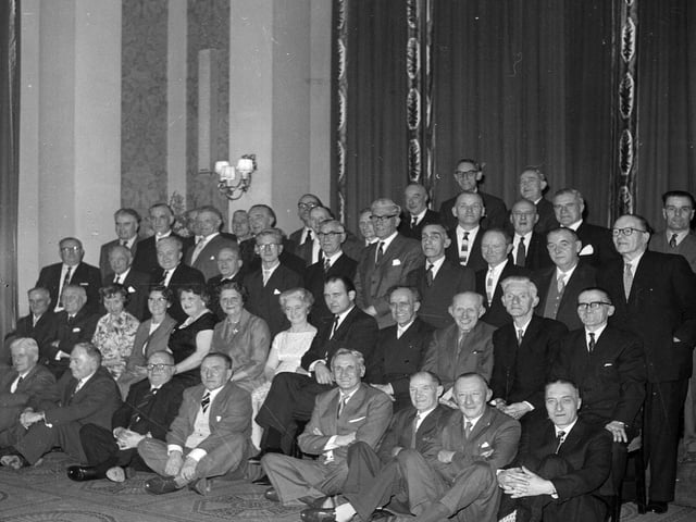 North British Rubber Company employees receive gold watches for 40 years service in February 1964.