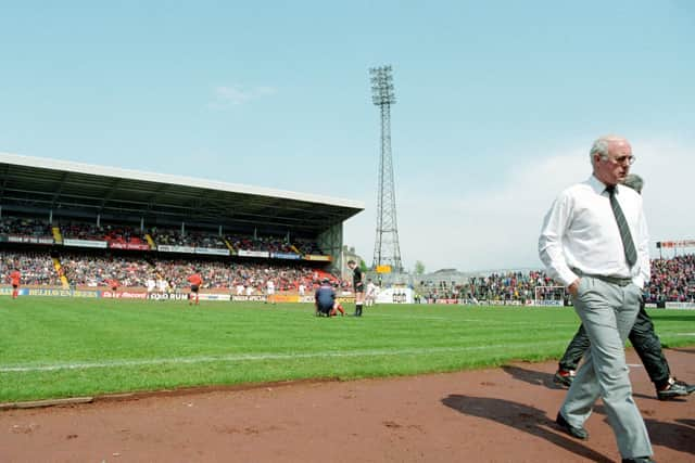 Jim McLean returns to his seat in the dugout during his last game as manager, against Aberdeen at Tannadice in 1993