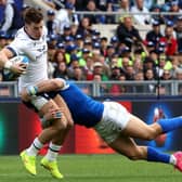 Blair Kinghorn of Scotland is tackled by Italy's Tommaso Menencello as the visitors let slip a lead against the Azzurri in Rome.