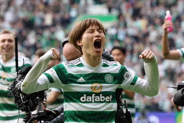 Kyogo Furuhashi celebrates Celtic's win with the club's fans.