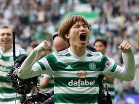 Kyogo Furuhashi celebrates Celtic's win with the club's fans.