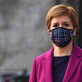 Nicola Sturgeon wearing a protective face covering while campaigning with Edinburgh Western candidate Sarah Masson on April 20 in South Queensferry, Scotland (Photo by Andy Buchanan - Pool/Getty Images).