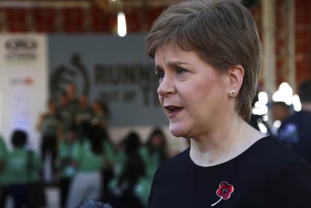 Nicola Sturgeon speaks to members of the media at the finish line of the Running Out Of Time climate relay. Picture: AP Photo/Thomas Hartwell