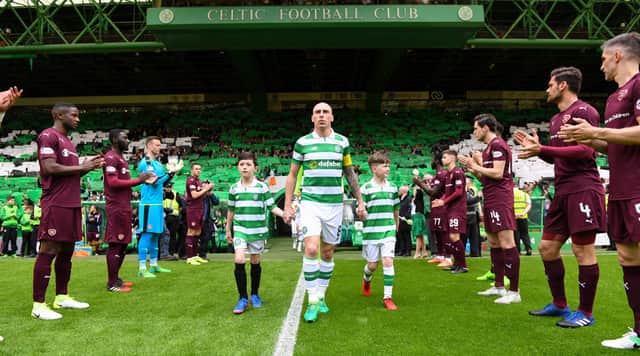 Giving a guard of honour to league champions before the end of the season is a tradition in Scottish football - as displayed by Hearts at Celtic Park in 2017. Pic: SNS