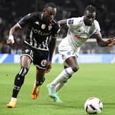Rangers target Abdallah Sima (left) in action while on loan at Angers last season. (Photo by JEAN-FRANCOIS MONIER/AFP via Getty Images)