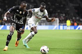 Rangers target Abdallah Sima (left) in action while on loan at Angers last season. (Photo by JEAN-FRANCOIS MONIER/AFP via Getty Images)