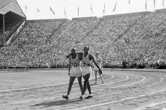 Barney Ewell, left, and Harrison Dillard walk arm in arm after the final of the 100 metres event at the 1948 London Olympics at Wembley Stadium. Dillard was declared the winner after a photo-finish, with Ewell second.  Picture: Haywood Magee/Picture Post/Hulton Archive/Getty Images