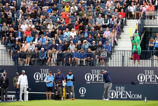 Jon Rahm is watched by fans from behind the first tee at Royal St George’s on the final practice day. Picture: Andrew Redington/Getty Images.