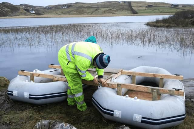 Fetching the sediments from Loch na Claise. PIC: Louise Matthews.