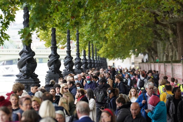 Members of the public join the queue on the South Bank, as they wait to view Queen Elizabeth II lying in state ahead of her funeral on Monday. Picture date: Wednesday September 14, 2022.