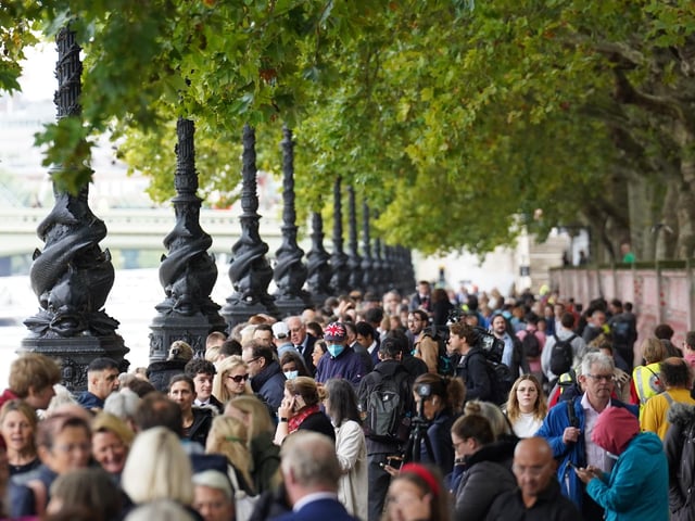 Members of the public join the queue on the South Bank, as they wait to view Queen Elizabeth II lying in state ahead of her funeral on Monday. Picture date: Wednesday September 14, 2022.