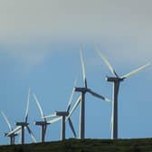 Stornoway Community Council is urging local planners to accept an offer from Scottish ministers to hold a public enquiry into proposals to build a giant wind farm on the edge of the islands' capital