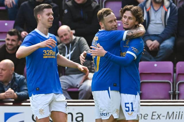 Rangers' Alex Lowry celebrates with teammates after making it 2-1  during a cinch Premiership match between Heart of Midlothian and Rangers at Tynecastle. (Photo by Ross Parker / SNS Group)
