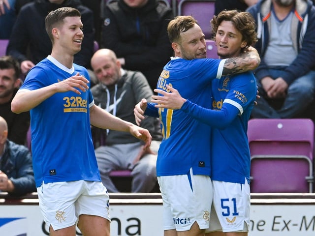 Rangers' Alex Lowry celebrates with teammates after making it 2-1 during a cinch Premiership match between Heart of Midlothian and Rangers at Tynecastle. (Photo by Ross Parker / SNS Group)